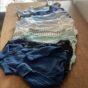 Assorted Baby Onesies in Blue, White, and Gray